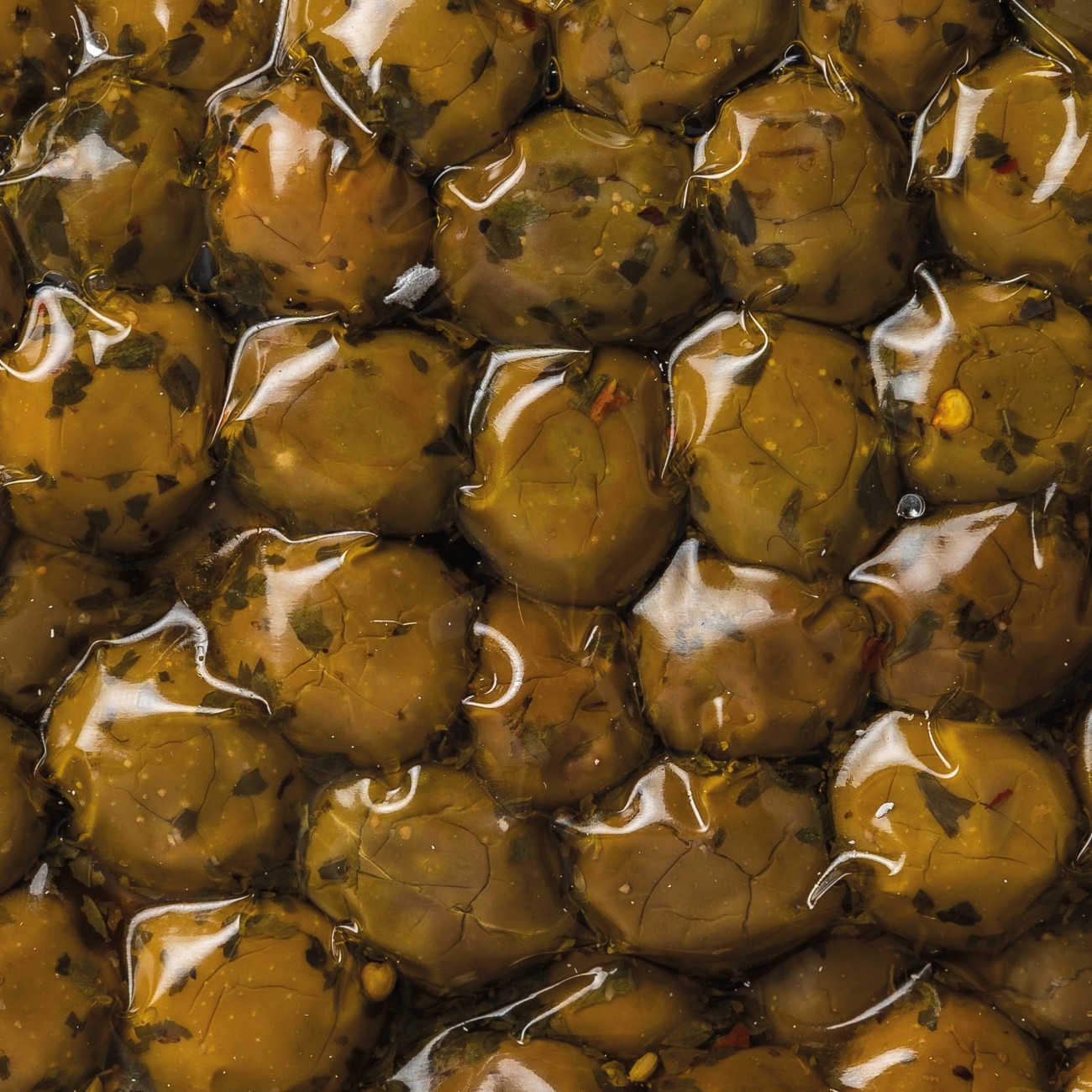 Olive schiacciate varietà Nocellara con aromi secchi e olio evo  lavorazione al naturale in busta
